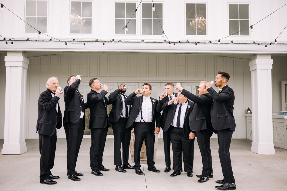 Providence_lavitaphotography-192 Groom with groomsmen having fun at Providence Vineyard Chicago wedding photographer