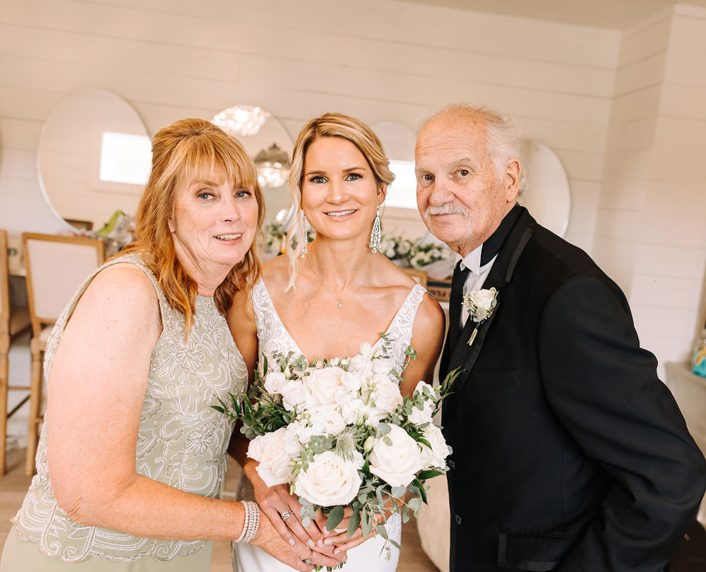 Providence_lavitaphotography-369 Chicago wedding photographer capturing bride with parents at Providence Vineyard venue