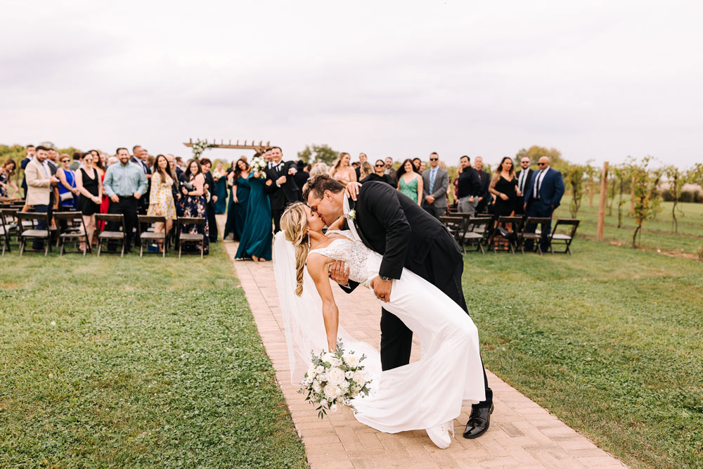 Providence_lavitaphotography-871 Newlywed kiss at Providence Vineyard wedding venue Chicago wedding photography