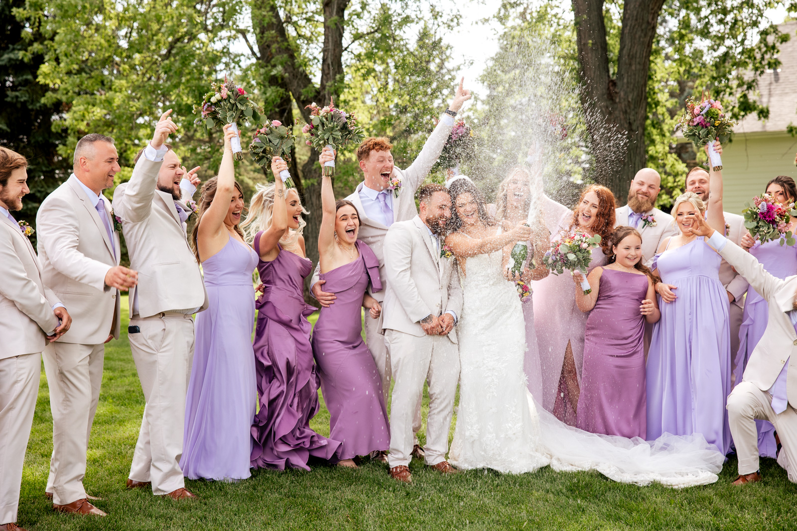 bride and groom with bridal party having fun Crystal Creek Farm Crystal Lake IL