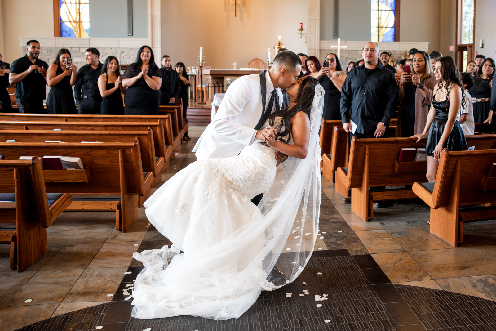 2026-08-08 Naperville_Lavita Photography-51 Newlywed kiss in church wedding ceremony Chicago